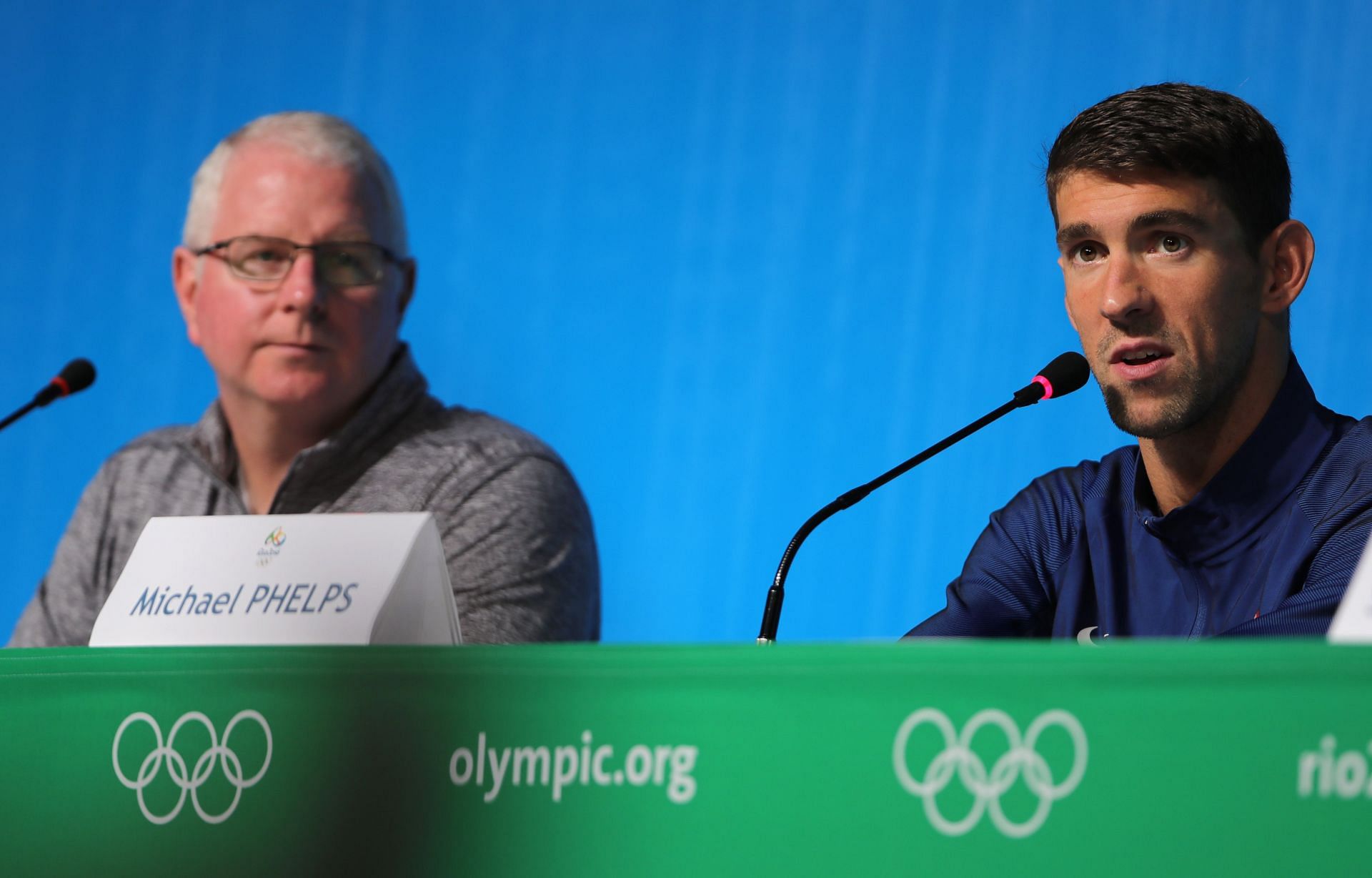 Michael Phelps (R) and coach Bob Bowman (USA) prior to the Rio 2016 Olympic Games (Photo by Michael Kappeler/picture alliance via Getty Images)